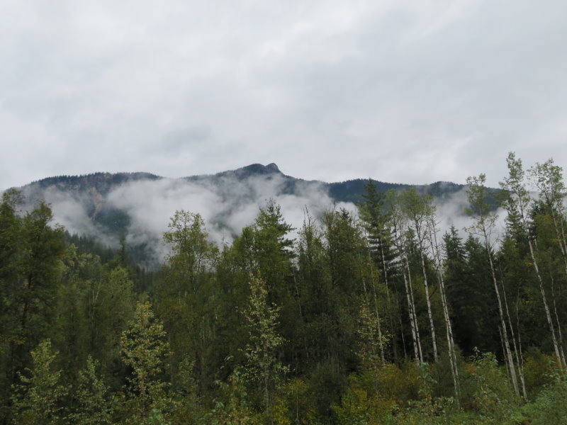 Fog nestled on the sides of the mountains
